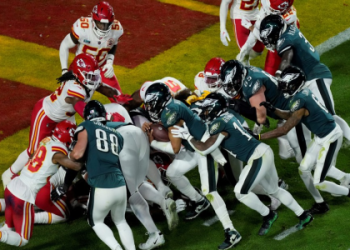 Why do football players wear towels? Understand how towels help players during intense games and practices.